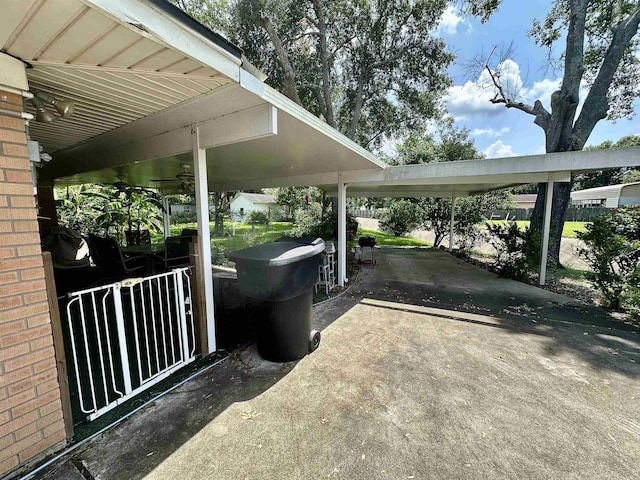 view of parking / parking lot featuring ceiling fan