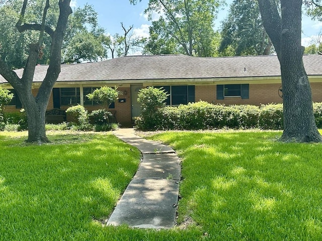 ranch-style house with a front lawn