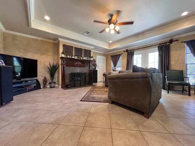 5770 Scenic Dr, Beaumont, TX 77713 - living area featuring a raised ceiling, a ceiling fan, ornamental molding, a fireplace, and light tile patterned floors