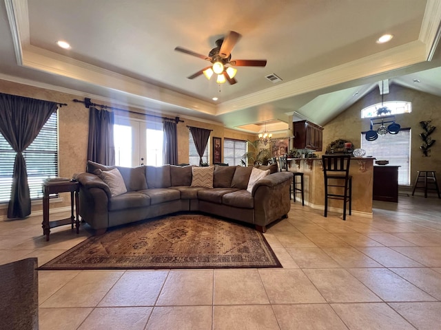5770 Scenic Dr, Beaumont, TX 77713 - living area featuring a chandelier, ceiling fan, a tray ceiling, light tile patterned flooring, and ornamental molding