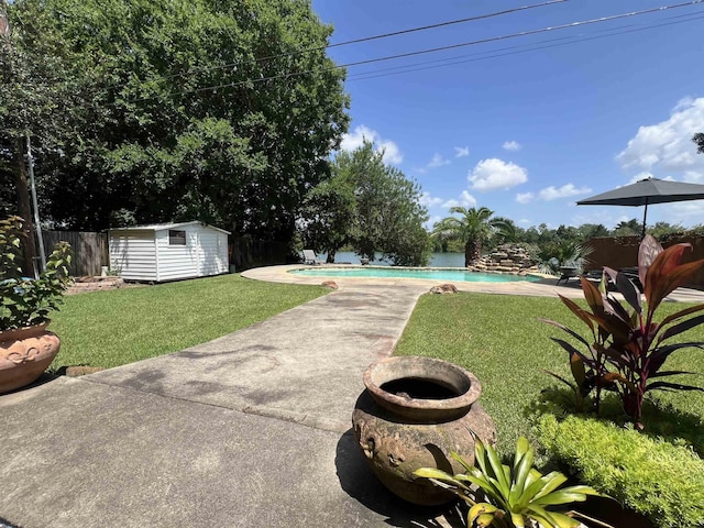 5770 Scenic Dr, Beaumont, TX 77713 - fenced backyard featuring a patio area, an outdoor pool, and a shed
