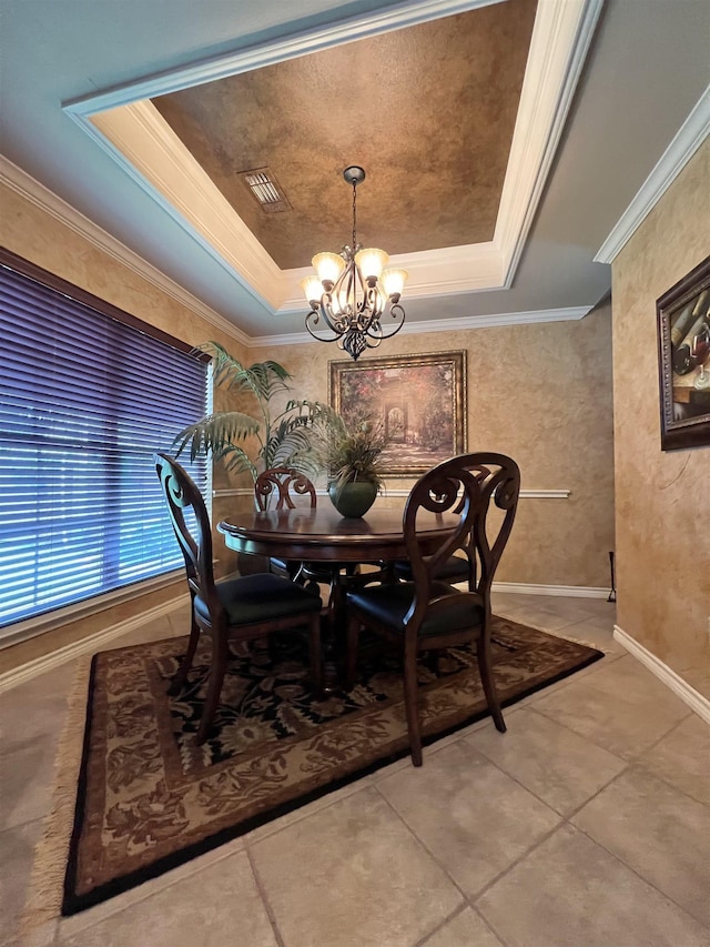 5770 Scenic Dr, Beaumont, TX 77713 - dining room with a tray ceiling, a chandelier, light tile patterned floors, and crown molding
