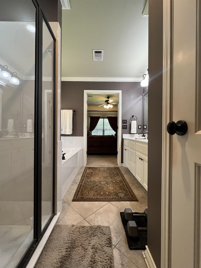 5770 Scenic Dr, Beaumont, TX 77713 - full bathroom with crown molding, tile patterned floors, vanity, a garden tub, and a shower stall