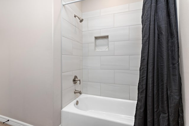 bathroom featuring shower / bath combo with shower curtain