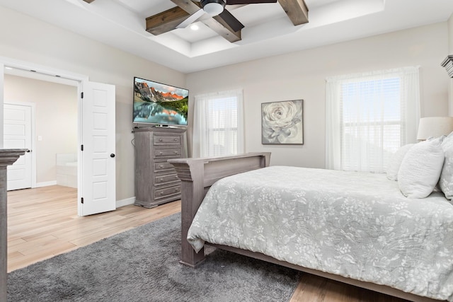 bedroom with beam ceiling, ceiling fan, coffered ceiling, and light wood-type flooring