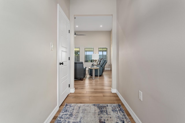 corridor featuring light hardwood / wood-style floors