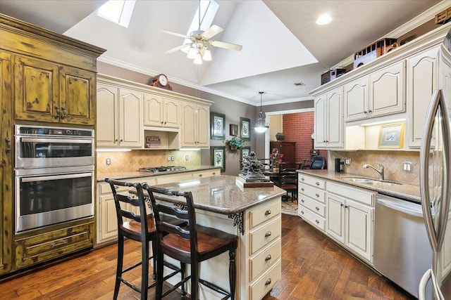 6401 Steeple Chasse Dr, Orange, TX 77632 - kitchen featuring stainless steel appliances, a center island, decorative backsplash, and decorative light fixtures