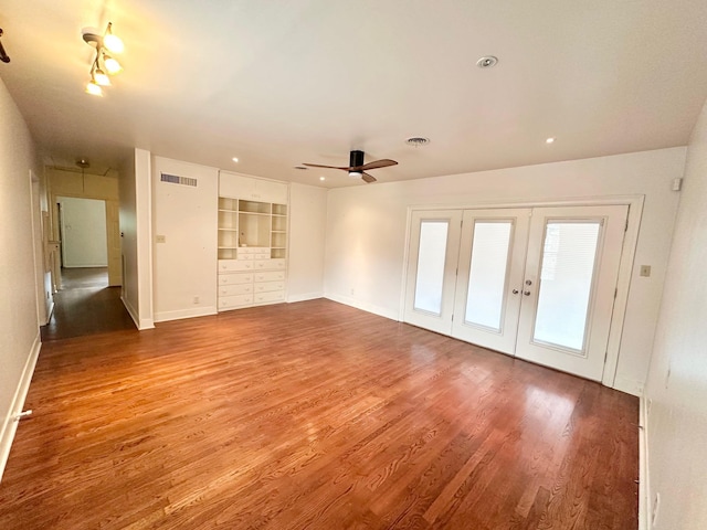 unfurnished living room featuring ceiling fan, french doors, and wood-type flooring