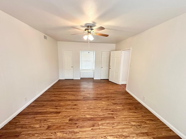 unfurnished bedroom featuring wood-type flooring and ceiling fan