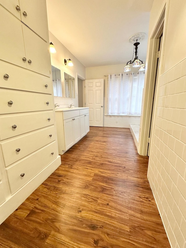 bathroom with vanity and hardwood / wood-style flooring