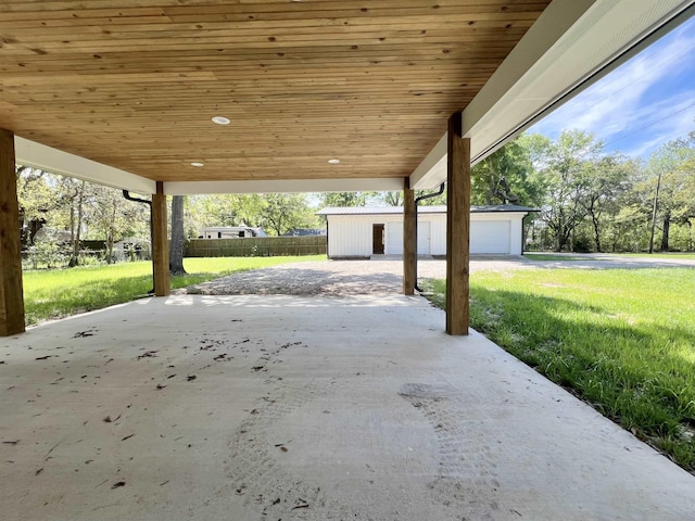 view of patio with a garage and an outdoor structure