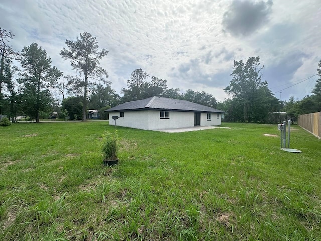 view of property exterior featuring a lawn