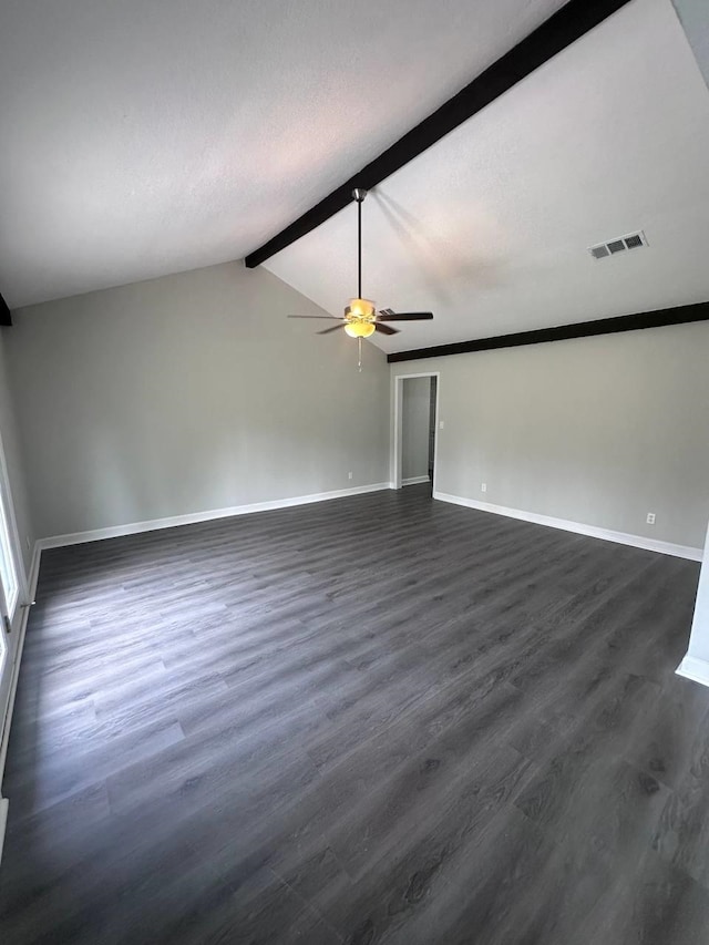 spare room with vaulted ceiling with beams, dark hardwood / wood-style floors, and ceiling fan