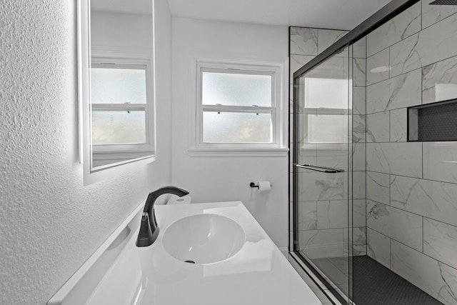 2319 Helena Ave, Nederland, TX 77627 - full bathroom with a shower stall, a textured wall, and vanity