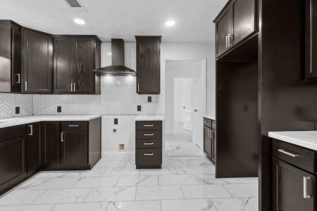 2319 Helena Ave, Nederland, TX 77627 - kitchen featuring wall chimney exhaust hood, light marble finish flooring, baseboards, tasteful backsplash, and recessed lighting