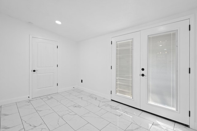 2319 Helena Ave, Nederland, TX 77627 - unfurnished room featuring french doors, light marble finish floors, recessed lighting, and baseboards