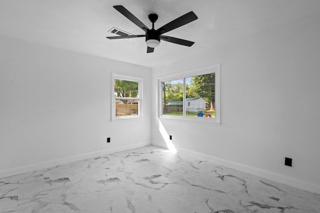 2319 Helena Ave, Nederland, TX 77627 - spare room with light marble finish flooring, baseboards, and a ceiling fan