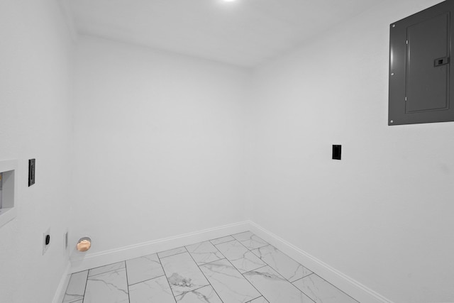 2319 Helena Ave, Nederland, TX 77627 - laundry room with electric panel, baseboards, and light marble finish floors