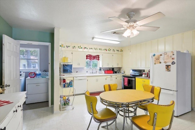 kitchen featuring ceiling fan, sink, a textured ceiling, white appliances, and white cabinets