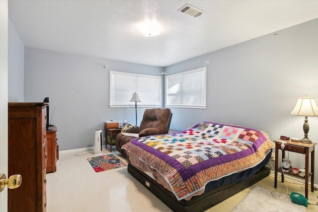 bedroom featuring a textured ceiling