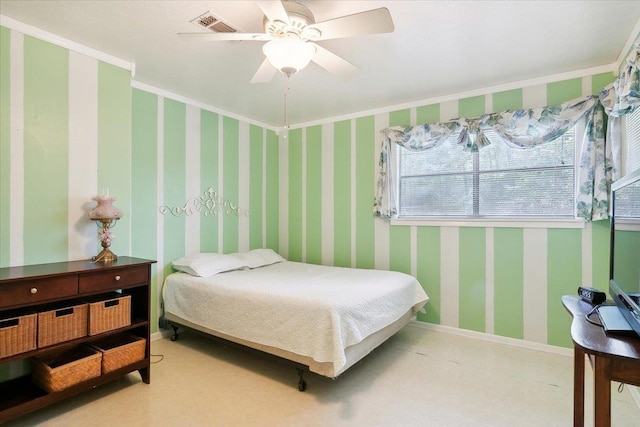 bedroom with ceiling fan and ornamental molding