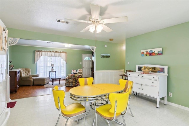 dining room featuring ceiling fan