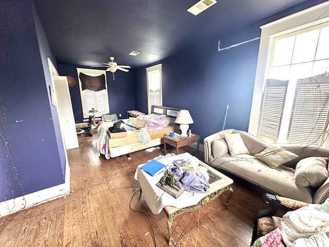 bedroom with ceiling fan and dark hardwood / wood-style floors