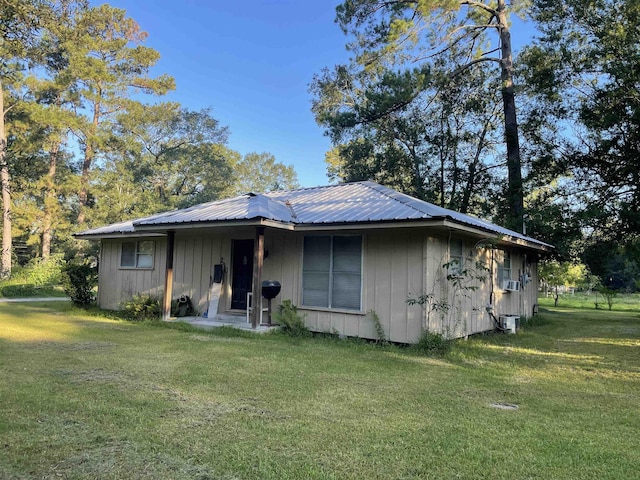 rear view of house with a lawn