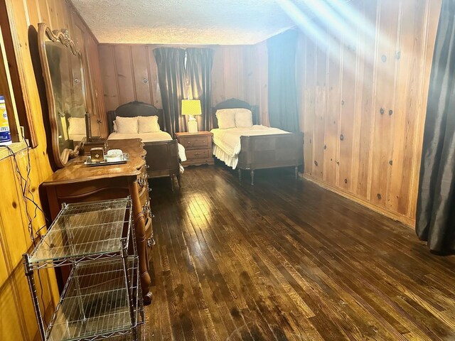 4350 Dallas Ave, Beaumont, TX 77703 - bedroom featuring wood-type flooring, wood walls, and a textured ceiling
