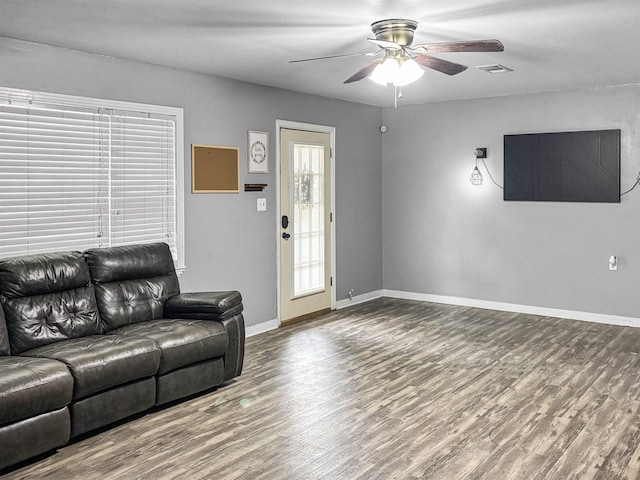 living room with ceiling fan and hardwood / wood-style floors