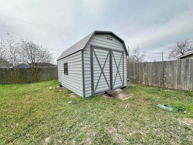 view of outbuilding featuring a yard