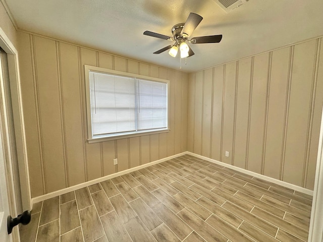 spare room featuring ceiling fan