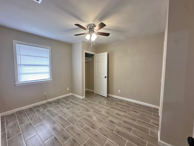 unfurnished bedroom with light hardwood / wood-style flooring, a closet, and ceiling fan