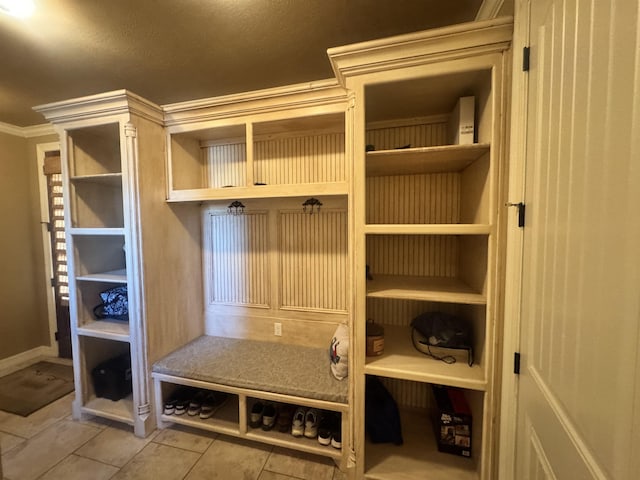 156 Remington Cir, Lumberton, TX 77657 - mudroom with ornamental molding, tile patterned floors, and baseboards
