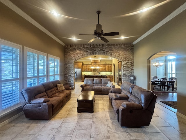 156 Remington Cir, Lumberton, TX 77657 - living room with arched walkways, a chandelier, ceiling fan, crown molding, and plenty of natural light