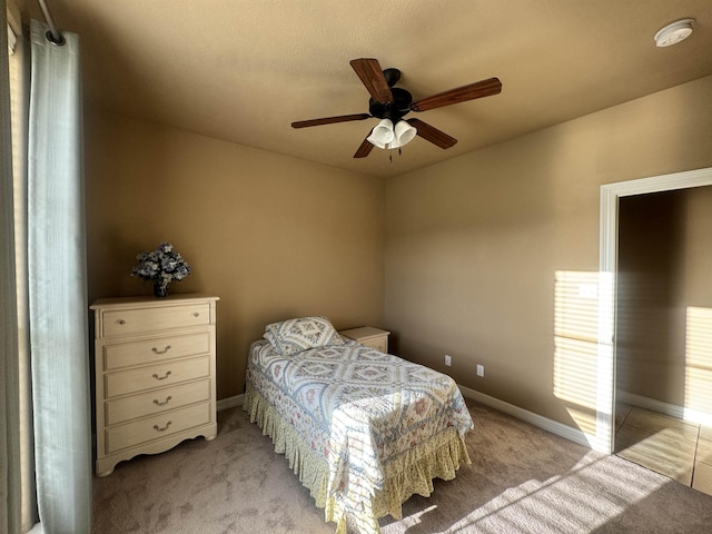 156 Remington Cir, Lumberton, TX 77657 - bedroom featuring light carpet, baseboards, and a ceiling fan