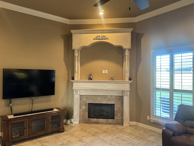 156 Remington Cir, Lumberton, TX 77657 - living area featuring a ceiling fan, crown molding, a tiled fireplace, and baseboards