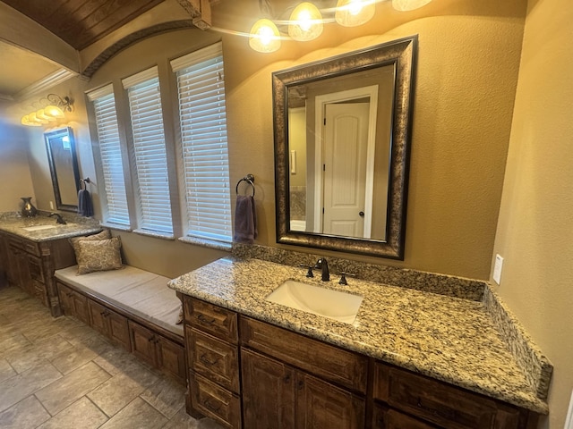 156 Remington Cir, Lumberton, TX 77657 - bathroom featuring stone finish floors, vanity, wooden ceiling, and a textured wall