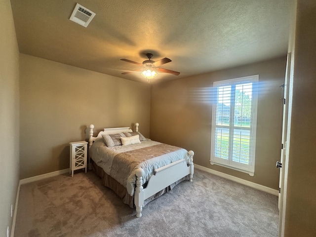 156 Remington Cir, Lumberton, TX 77657 - bedroom with carpet, a textured ceiling, baseboards, and a ceiling fan