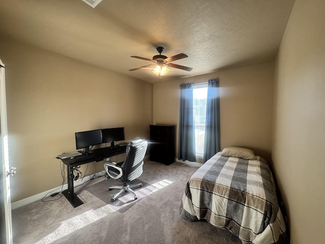 156 Remington Cir, Lumberton, TX 77657 - bedroom with carpet flooring, a desk, baseboards, ceiling fan, and a textured ceiling