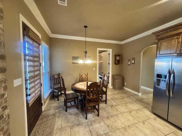 156 Remington Cir, Lumberton, TX 77657 - dining room with arched walkways, crown molding, and baseboards