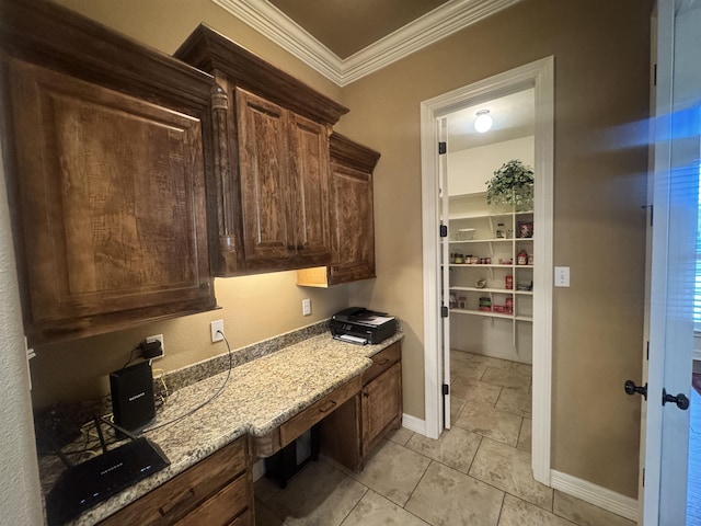 156 Remington Cir, Lumberton, TX 77657 - kitchen featuring ornamental molding, baseboards, light stone countertops, light tile patterned flooring, and dark brown cabinets