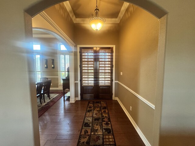 156 Remington Cir, Lumberton, TX 77657 - entrance foyer with crown molding, arched walkways, dark wood-style flooring, baseboards, and french doors