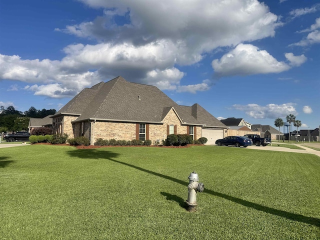 156 Remington Cir, Lumberton, TX 77657 - view of side of home with roof with shingles, a lawn, brick siding, and a garage