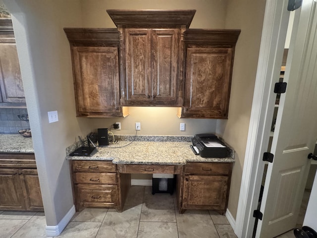 156 Remington Cir, Lumberton, TX 77657 - office area with built in study area, light tile patterned floors, and baseboards