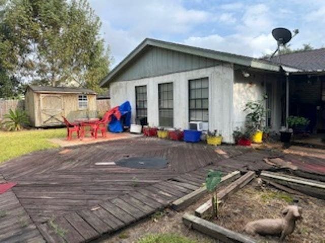 wooden deck featuring a shed