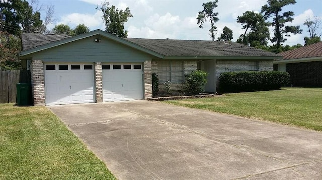 ranch-style house with a garage and a front yard