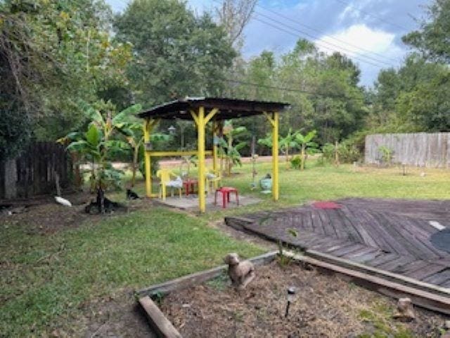 view of yard featuring a wooden deck