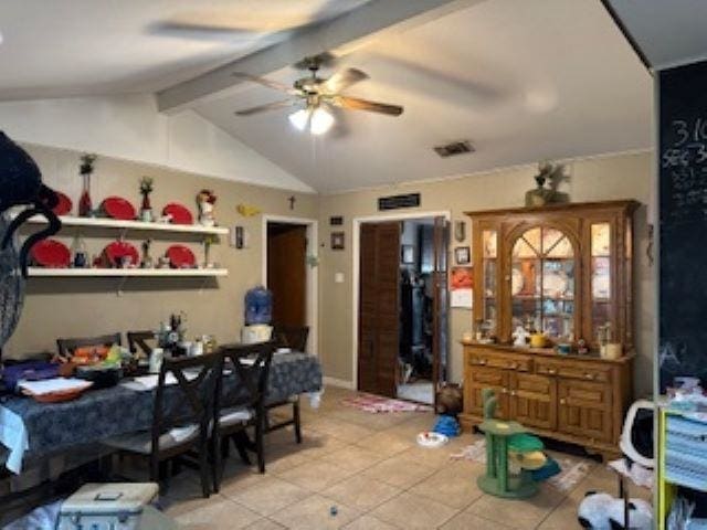 dining space with vaulted ceiling with beams and ceiling fan