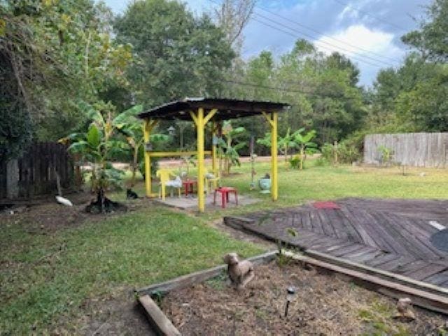 view of yard with a wooden deck